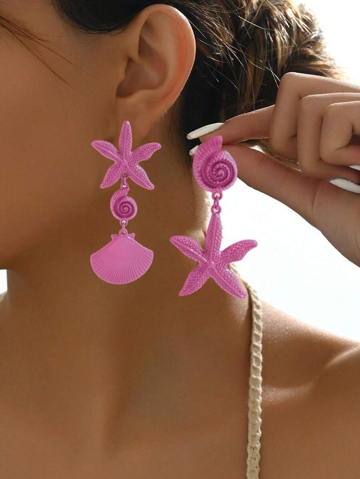 A pair of asymmetrical metal shell and starfish earrings for women in a stylish and practical beach holiday style, suitable for daily wear and festive events.